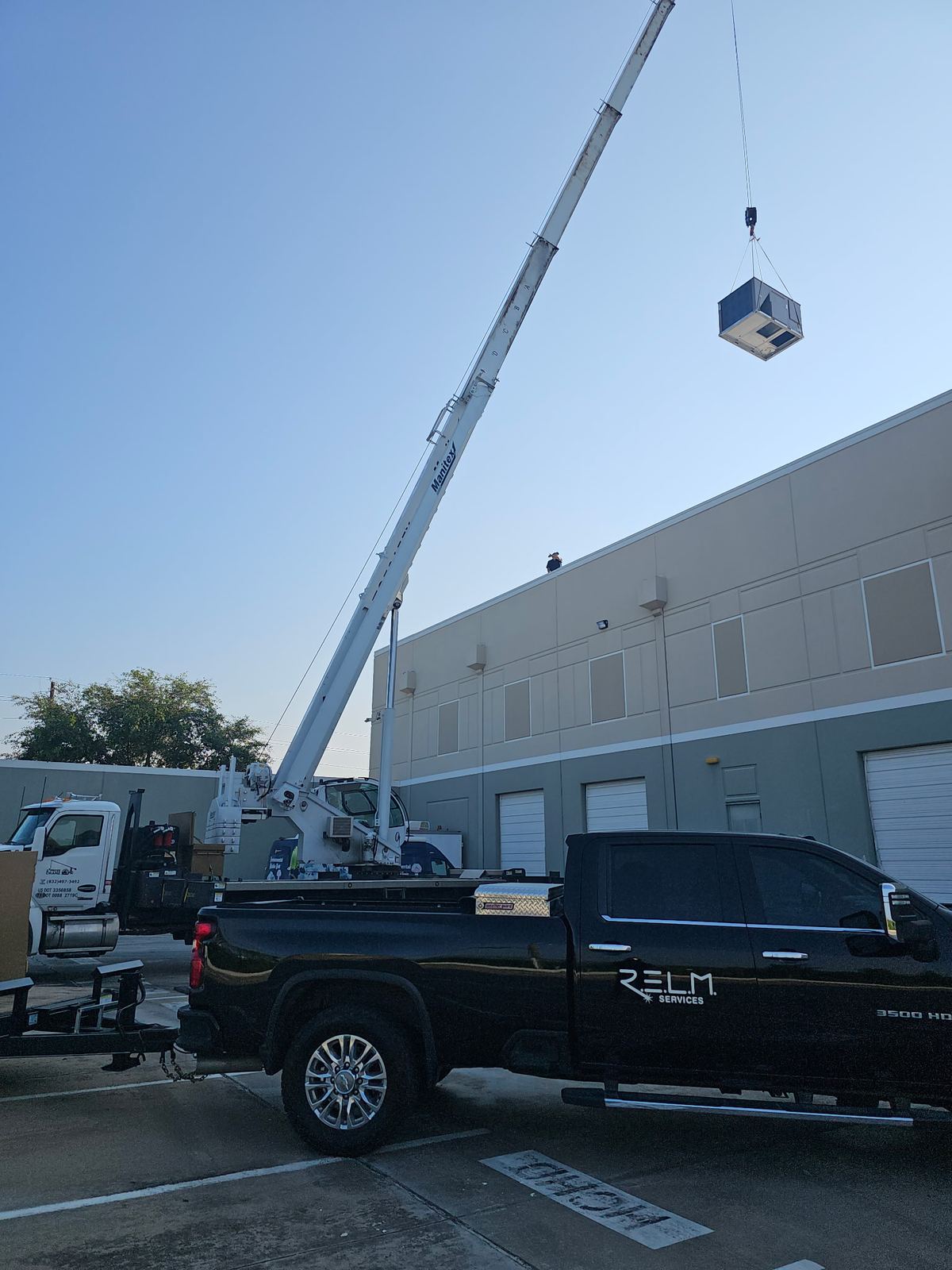 Relm Services crane truck on a job site